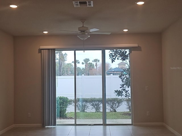 entryway featuring tile patterned flooring, a wealth of natural light, and ceiling fan