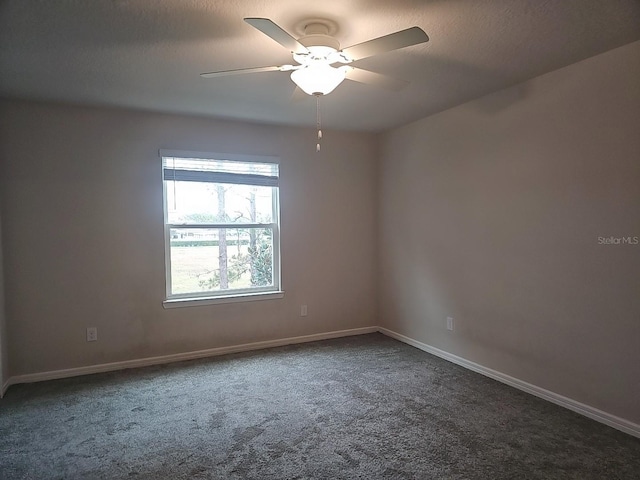 unfurnished room with ceiling fan, carpet flooring, and a textured ceiling