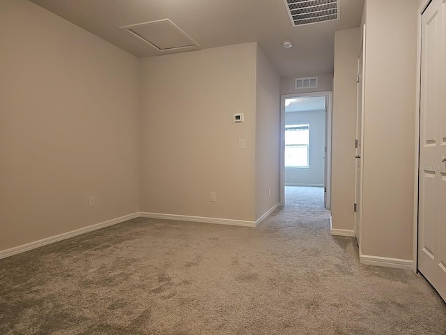 empty room with light colored carpet