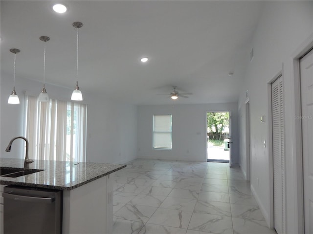 kitchen featuring sink, stone countertops, hanging light fixtures, dishwasher, and ceiling fan