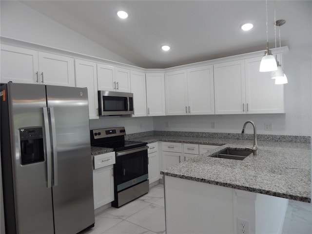 kitchen featuring sink, hanging light fixtures, stainless steel appliances, white cabinets, and kitchen peninsula