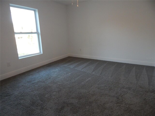 unfurnished room featuring carpet floors