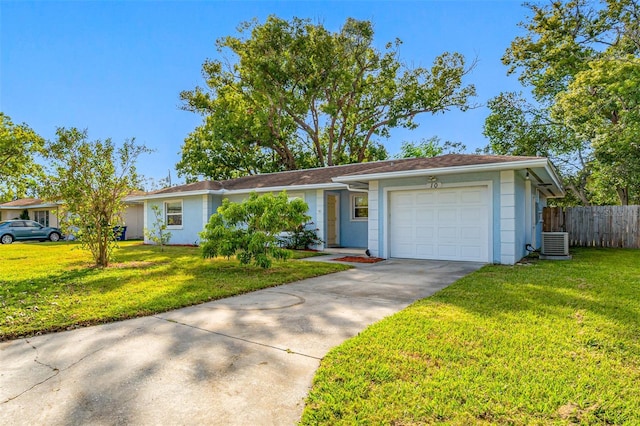 ranch-style home featuring a garage, central AC unit, and a front lawn