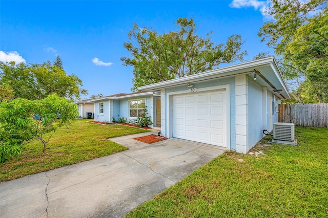 single story home with central AC unit, a garage, and a front lawn