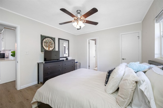 bedroom with ornamental molding, ceiling fan, and light wood-type flooring