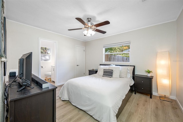 bedroom with crown molding, ceiling fan, ensuite bathroom, and light hardwood / wood-style floors