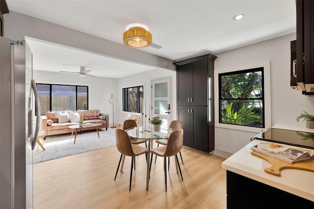 dining area with light hardwood / wood-style floors