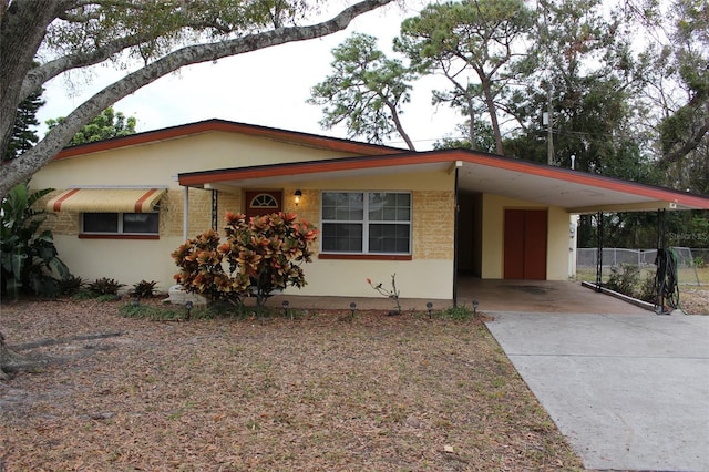 view of front of home with a carport