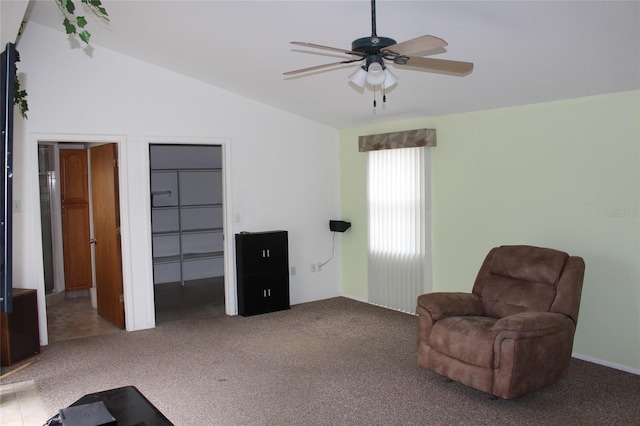 unfurnished room featuring lofted ceiling, ceiling fan, and carpet