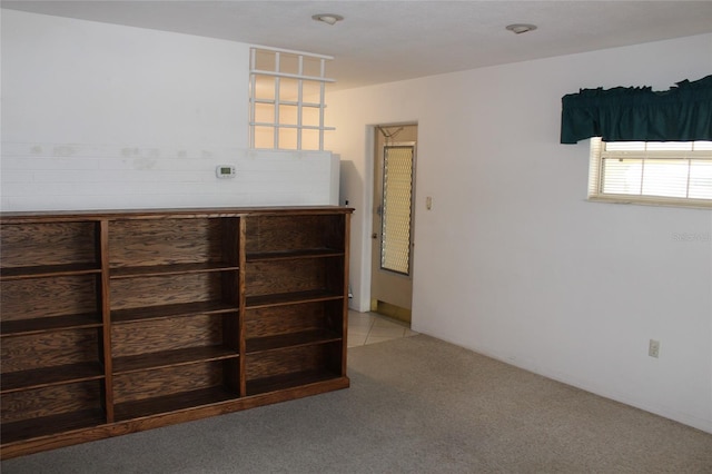 unfurnished bedroom with light colored carpet