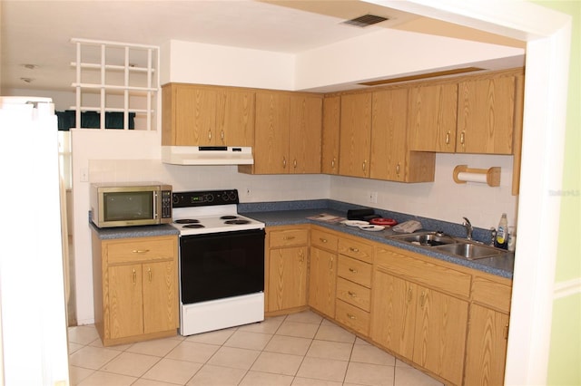 kitchen with sink, light tile patterned floors, electric range, white refrigerator, and decorative backsplash