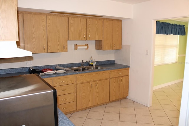 kitchen with sink, light tile patterned floors, and backsplash