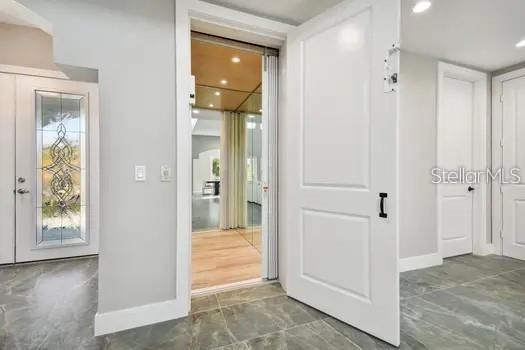 interior space featuring recessed lighting and baseboards