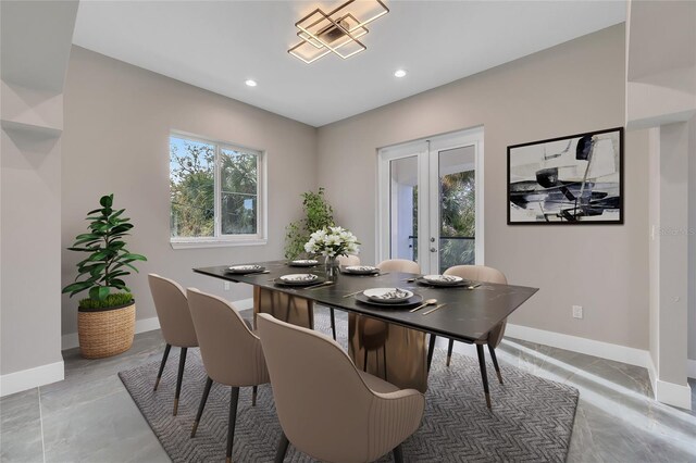 dining room with a wealth of natural light, french doors, and baseboards