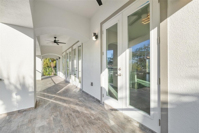 view of patio featuring french doors and ceiling fan