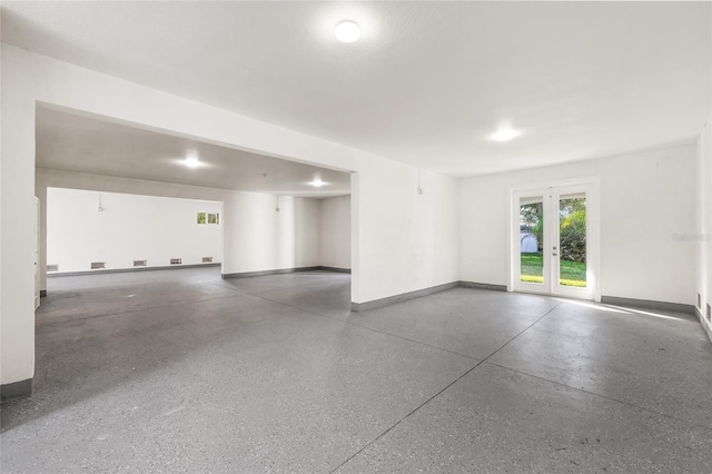 interior space featuring french doors and baseboards