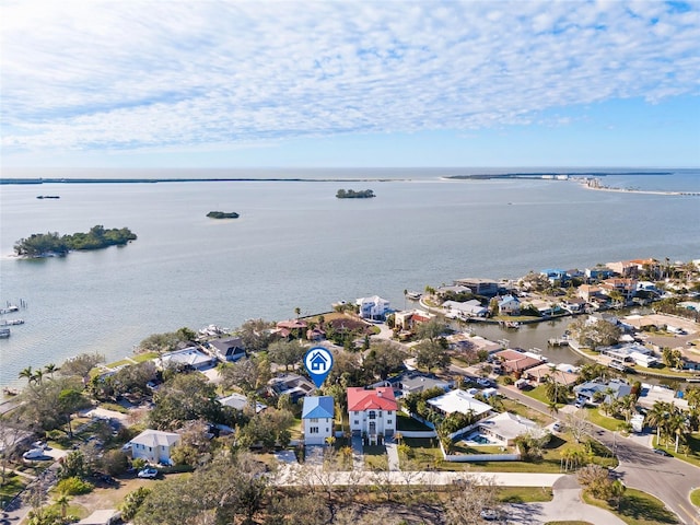 drone / aerial view featuring a residential view and a water view