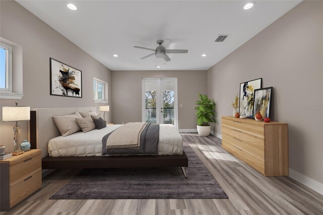 bedroom with ceiling fan and light hardwood / wood-style flooring