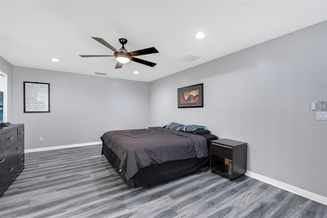 bedroom featuring dark wood-type flooring and ceiling fan