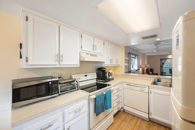 kitchen featuring sink, white cabinets, ceiling fan, white appliances, and light hardwood / wood-style flooring