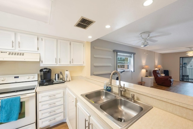 kitchen featuring sink, white appliances, ceiling fan, range hood, and white cabinets