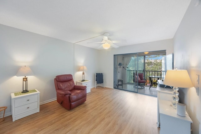 sitting room featuring light hardwood / wood-style floors and ceiling fan