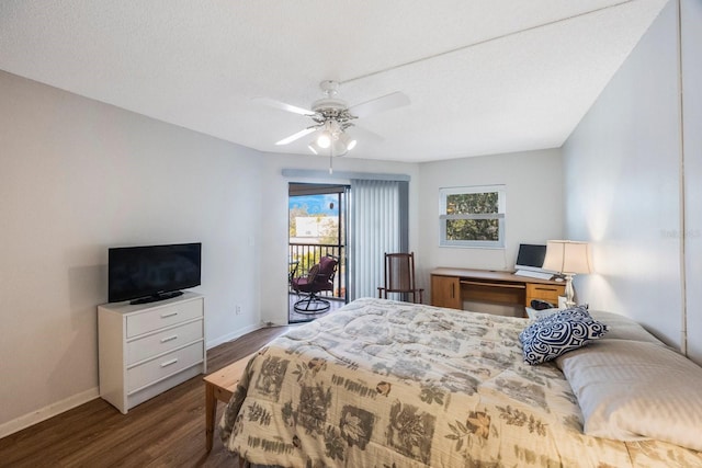 bedroom featuring a textured ceiling, access to outside, dark hardwood / wood-style floors, and ceiling fan