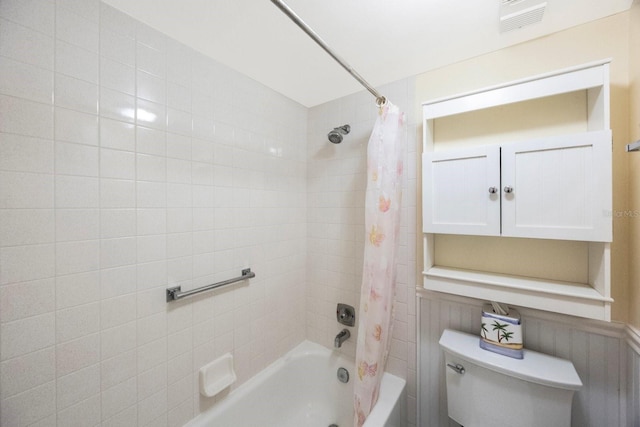 bathroom with toilet and shower / bath combo