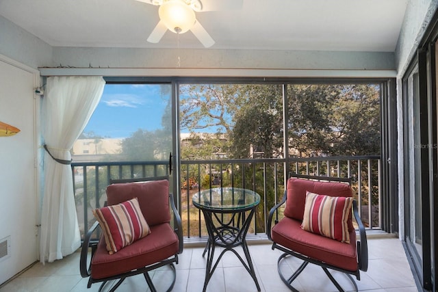 sunroom / solarium with ceiling fan