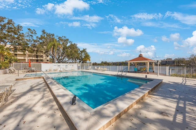 view of swimming pool featuring a gazebo and a patio area