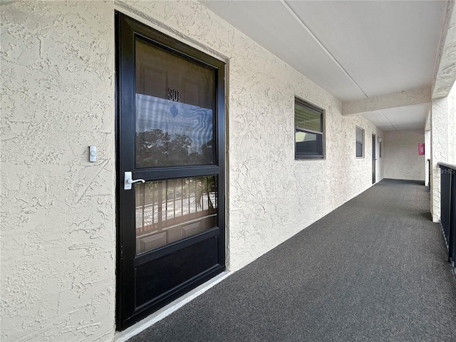 11485 Oakhurst Rd Unit A301, Largo, FL 33774 - view of exterior entry with stucco siding
