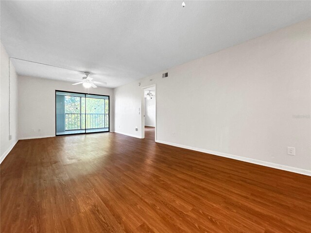11485 Oakhurst Rd Unit A301, Largo, FL 33774 - empty room featuring ceiling fan and dark wood-style floors