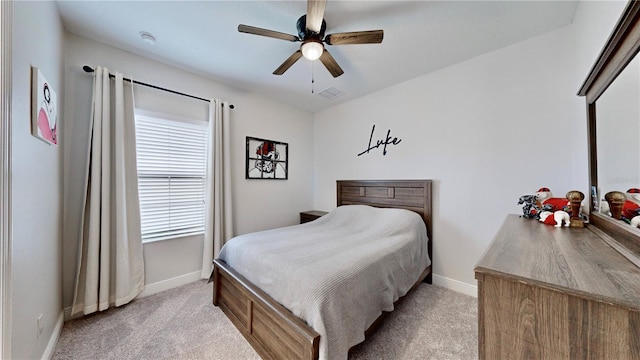 bedroom with ceiling fan and light colored carpet