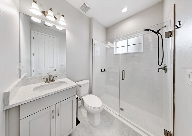 bathroom with walk in shower, tile patterned floors, vanity, and toilet