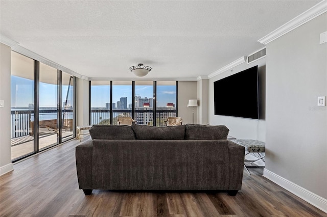 living room featuring expansive windows, crown molding, a textured ceiling, and dark hardwood / wood-style flooring