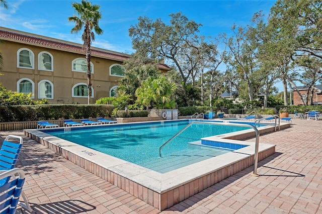 view of swimming pool featuring a patio