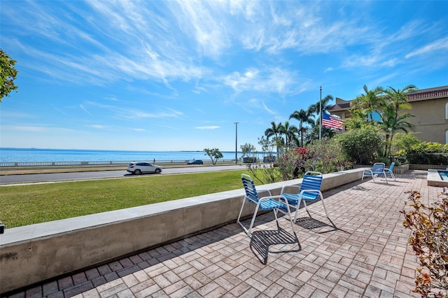 view of patio featuring a water view