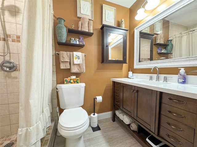 bathroom featuring walk in shower, vanity, toilet, and wood-type flooring