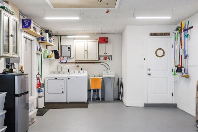 interior space with washing machine and dryer and cabinets