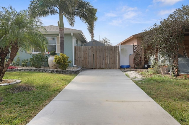 view of side of property with a lawn