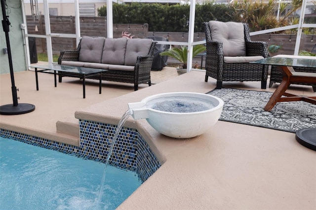 view of patio featuring an outdoor living space, a lanai, and pool water feature