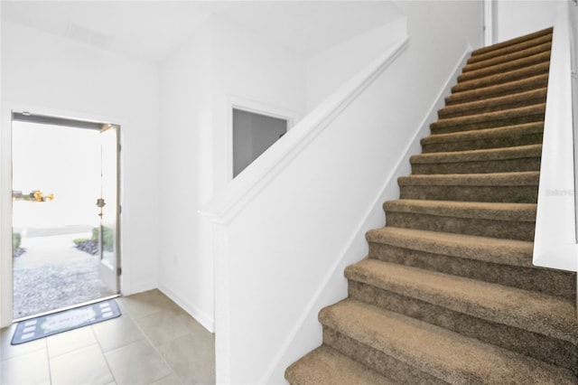 entrance foyer featuring light tile patterned flooring