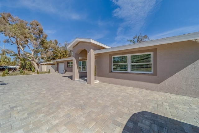 back of house with a garage