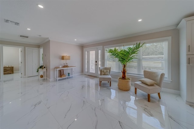 sitting room featuring ornamental molding