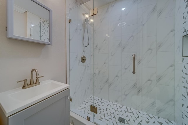 bathroom featuring vanity and an enclosed shower