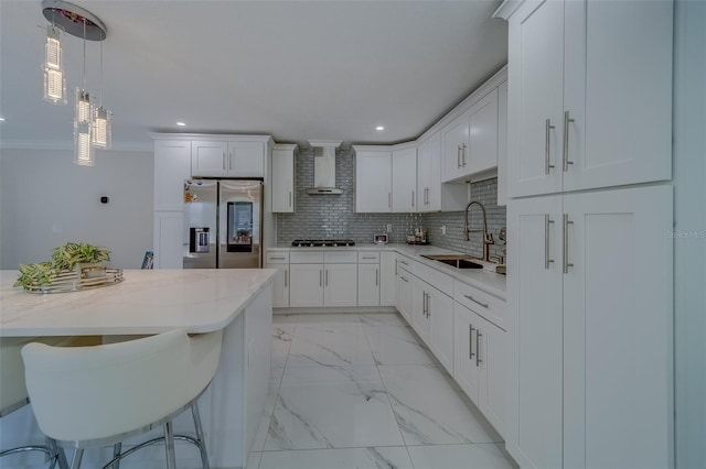 kitchen with stainless steel fridge with ice dispenser, sink, wall chimney range hood, and white cabinets