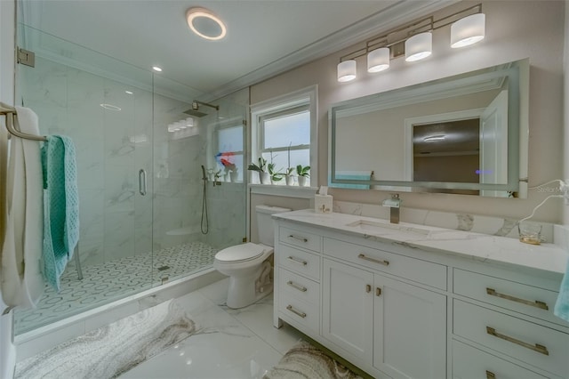 bathroom featuring vanity, a shower with shower door, ornamental molding, and toilet