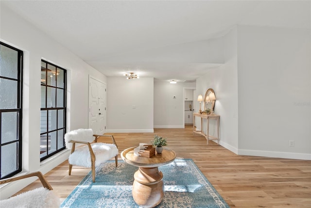 living area with light hardwood / wood-style flooring