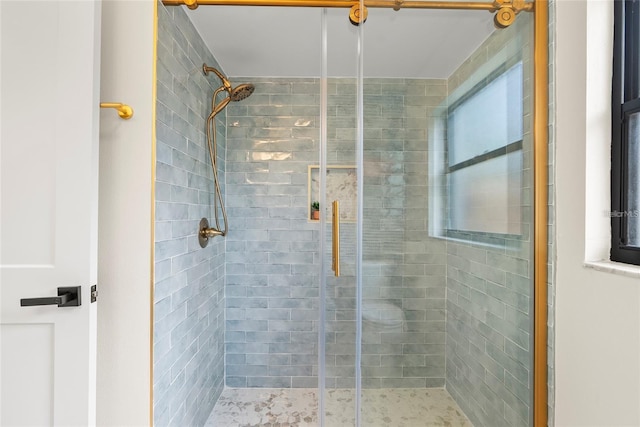 bathroom featuring an enclosed shower