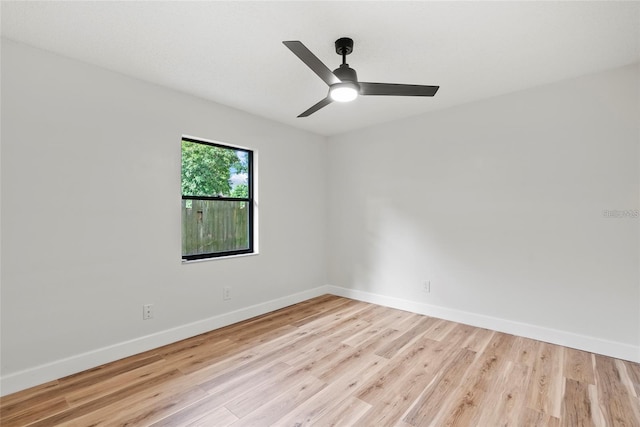 empty room with ceiling fan and light wood-type flooring